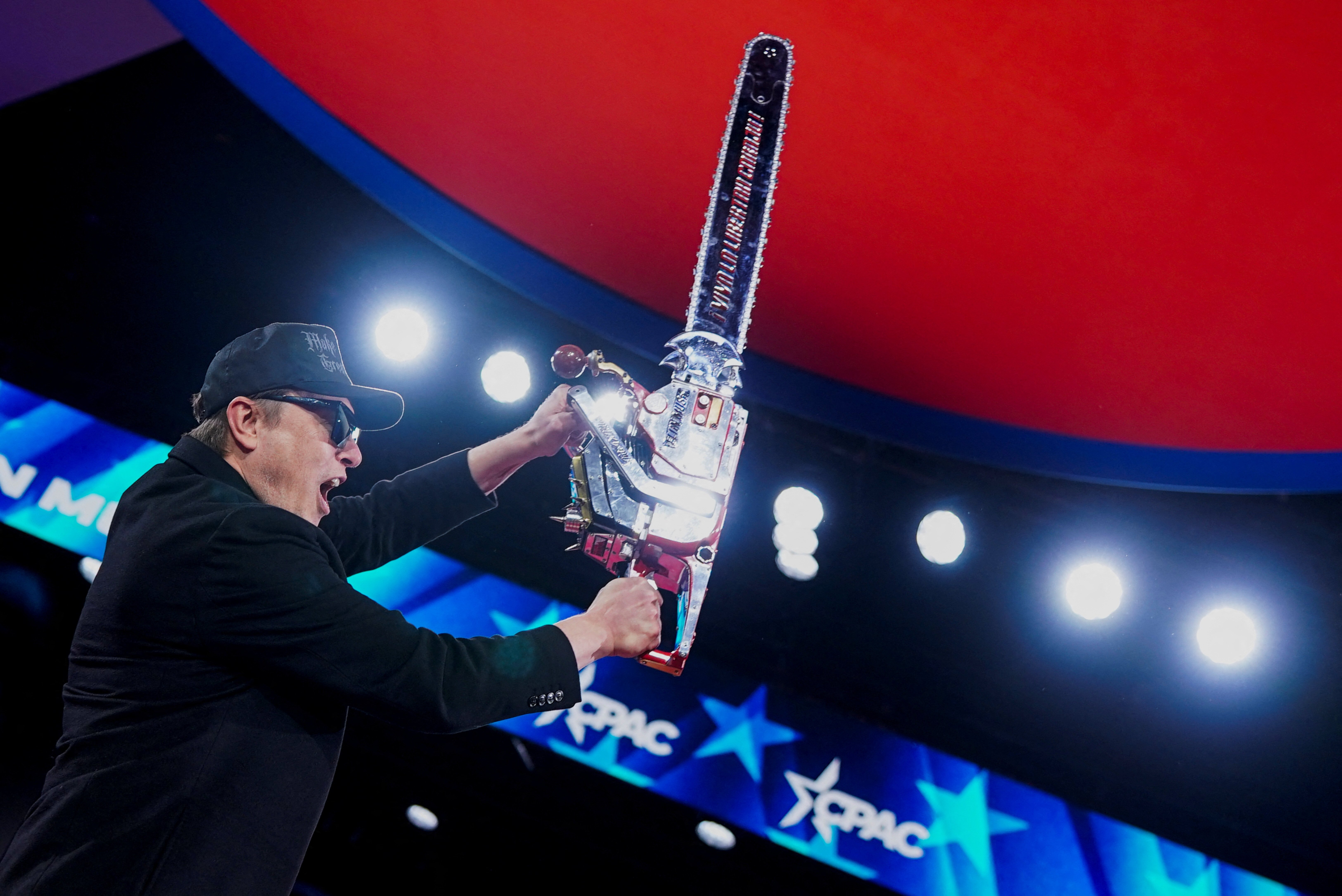 Musk waves a chainsaw and charms conservatives talking up Trump’s cost